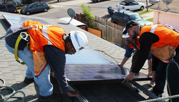 Students from the Green Technology Education program at Laney College worked for a day and half installing solar panels on Henry Avila's rooftop.